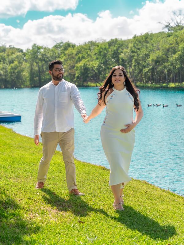 Couple walking beside the emerald lake