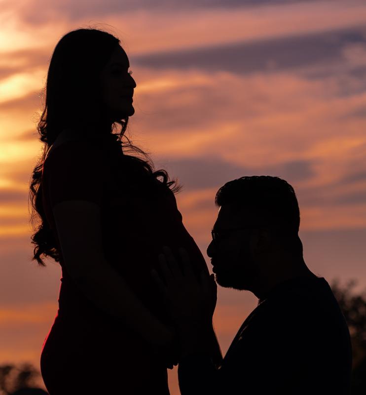 Couple silhouetted against the sunset