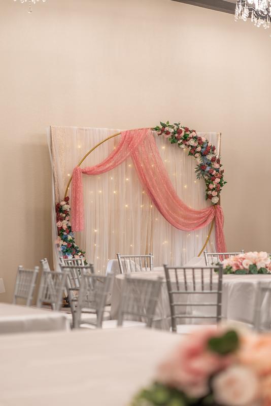 Floral arch detail with candles
