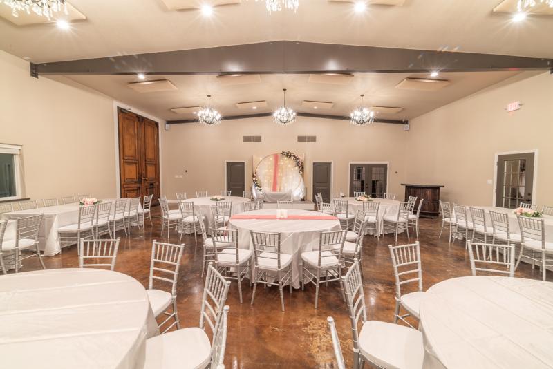 Grand hall set with round tables and chandeliers