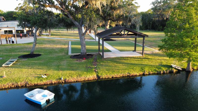 Lakeside pavilion and lawn beside the water