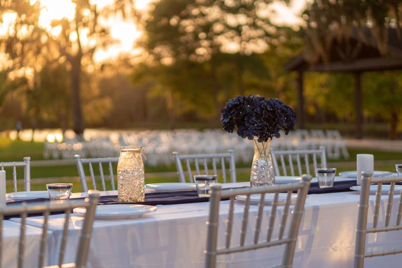 Outdoor table set for dinner at sunset